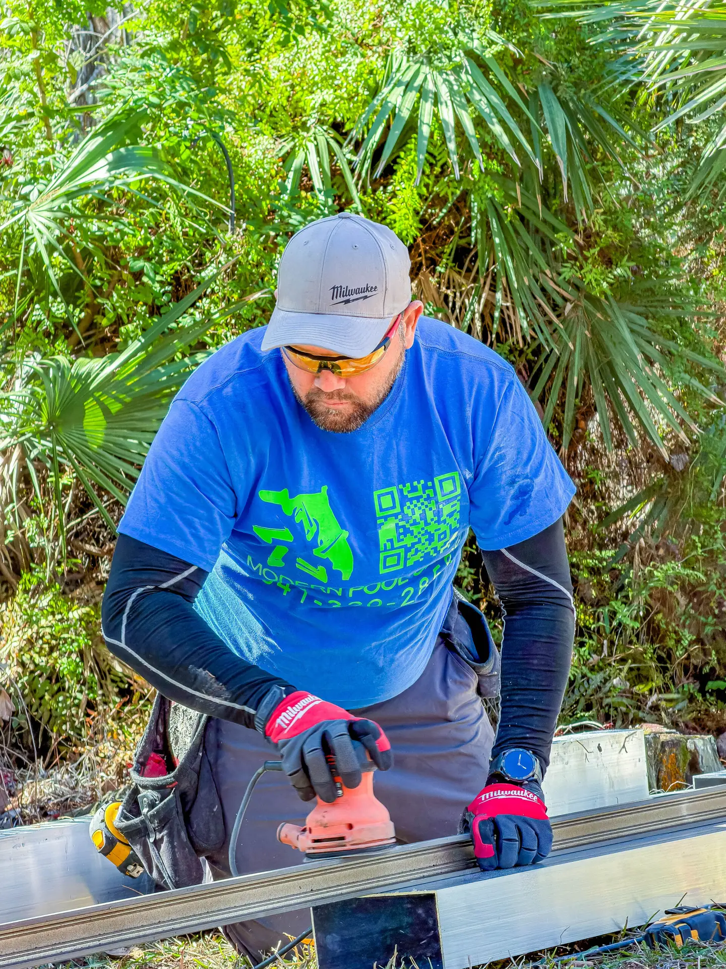 Modern Pool Cage technician restoring a pool cage frame in Florida