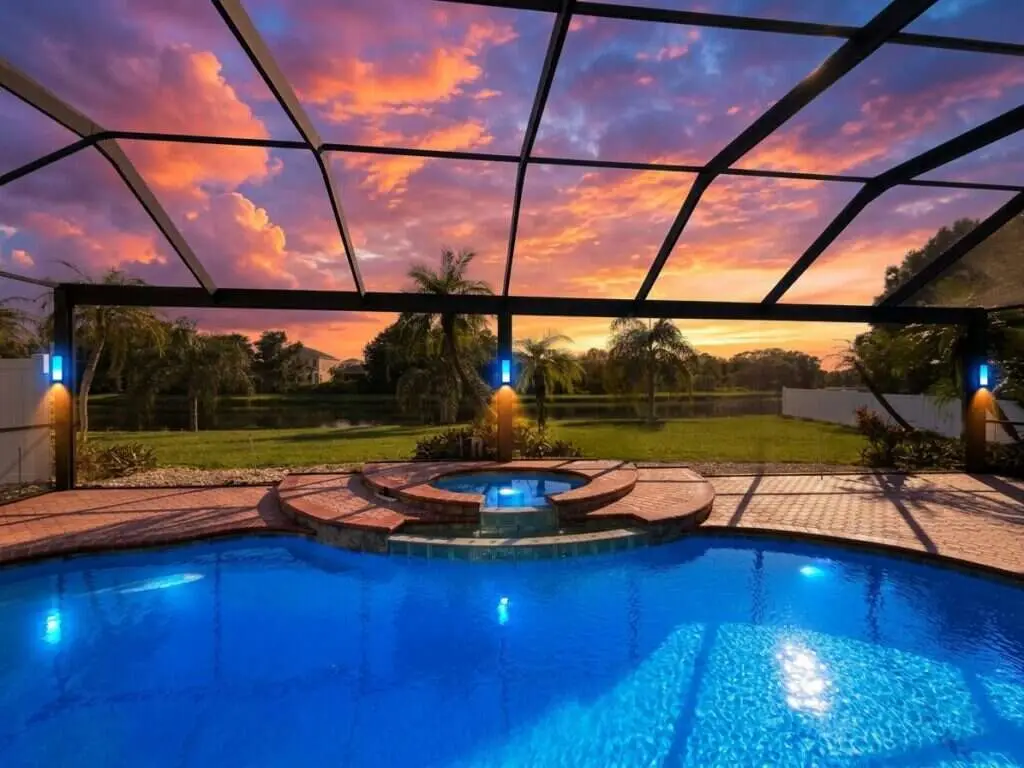 Black aluminum pool cage freshly painted and rescreened with a new panoramic picture-window screen (clear view)