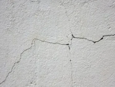 Cracks on a plain wall surface